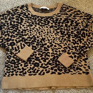 Left hip length leopard print sweater small